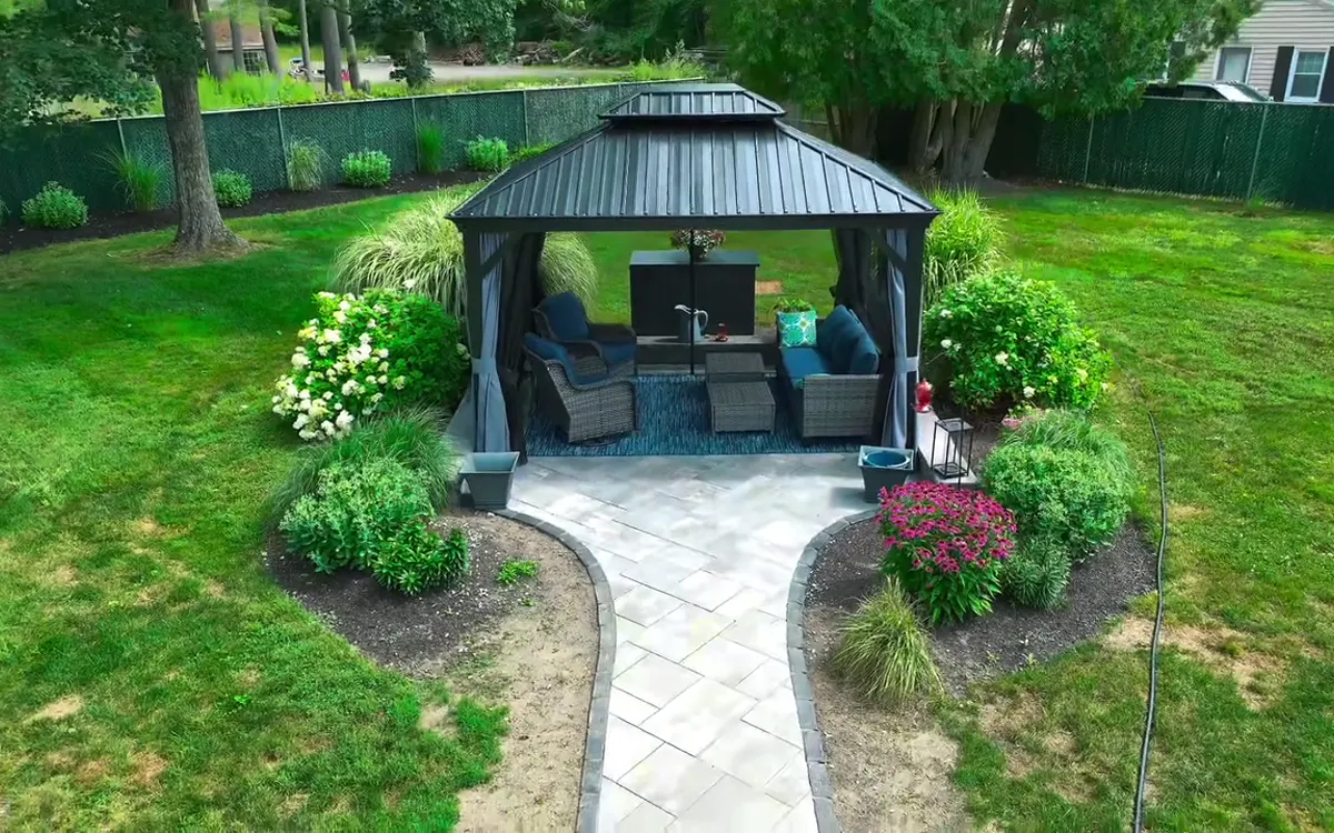 Aerial view of a residential patio, pavilion and surrounding lawn